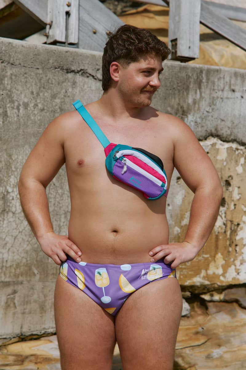 Mens swimwear with purple and lemon print. 